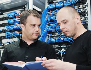 it engineer in network server room solving problems and give help and support